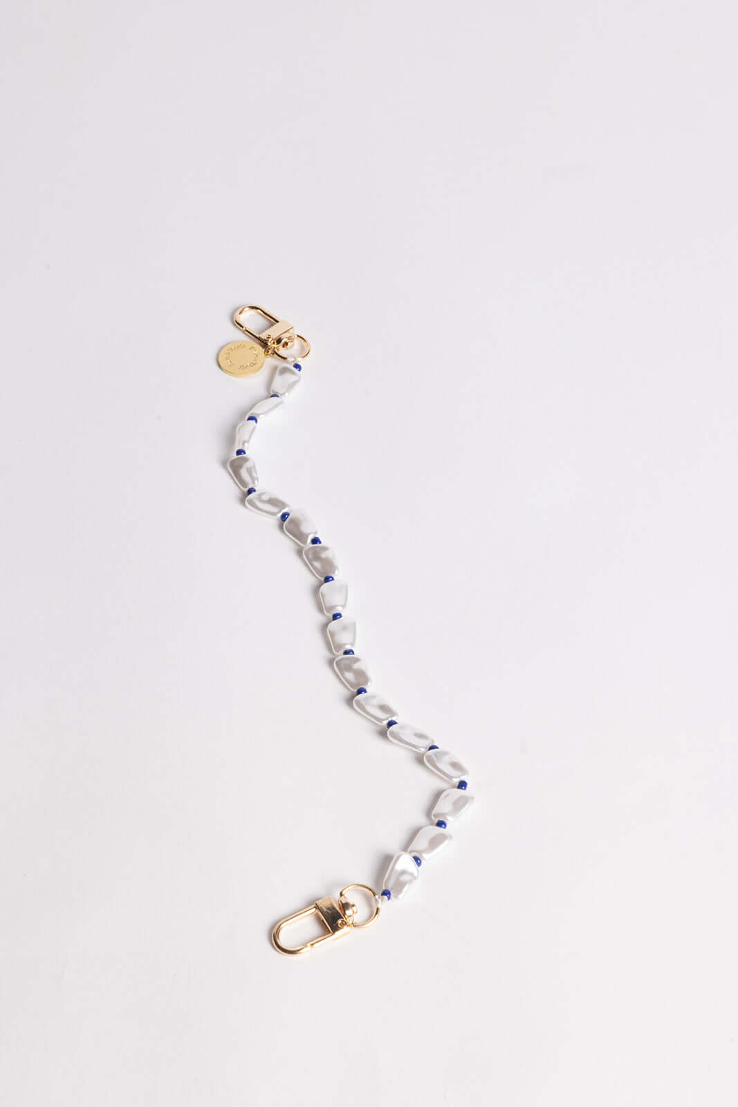 Folie à Trois korte telefoonketting Softer side